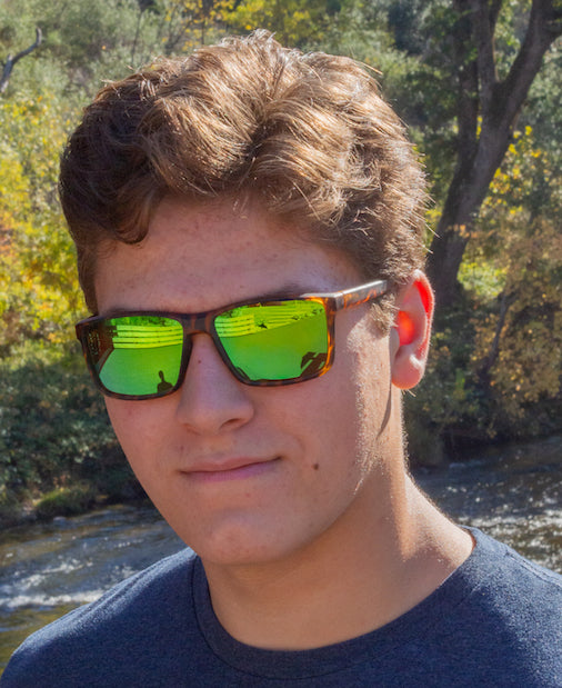 Man wearing Hektik Santa cruz sunglasses in Leopard with Goblin green lenses