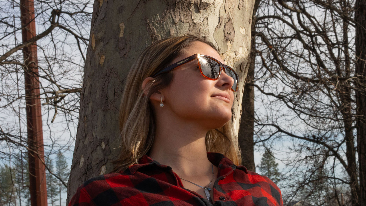 Woman wearing Hektik Modoc sunglasses in martian crystal with smoke lens